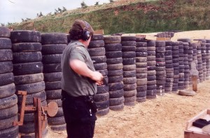 Me, when considerably younger, heavier, and happier, drawing from speed-holster. What larks!